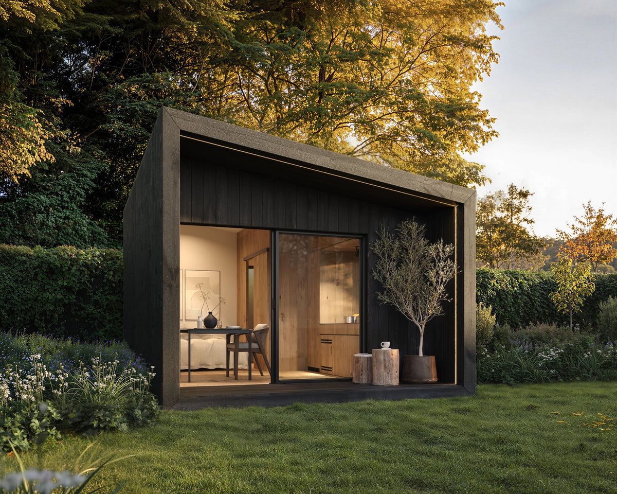 Visualisation of a black NOOK 20 with a bathroom, in a garden