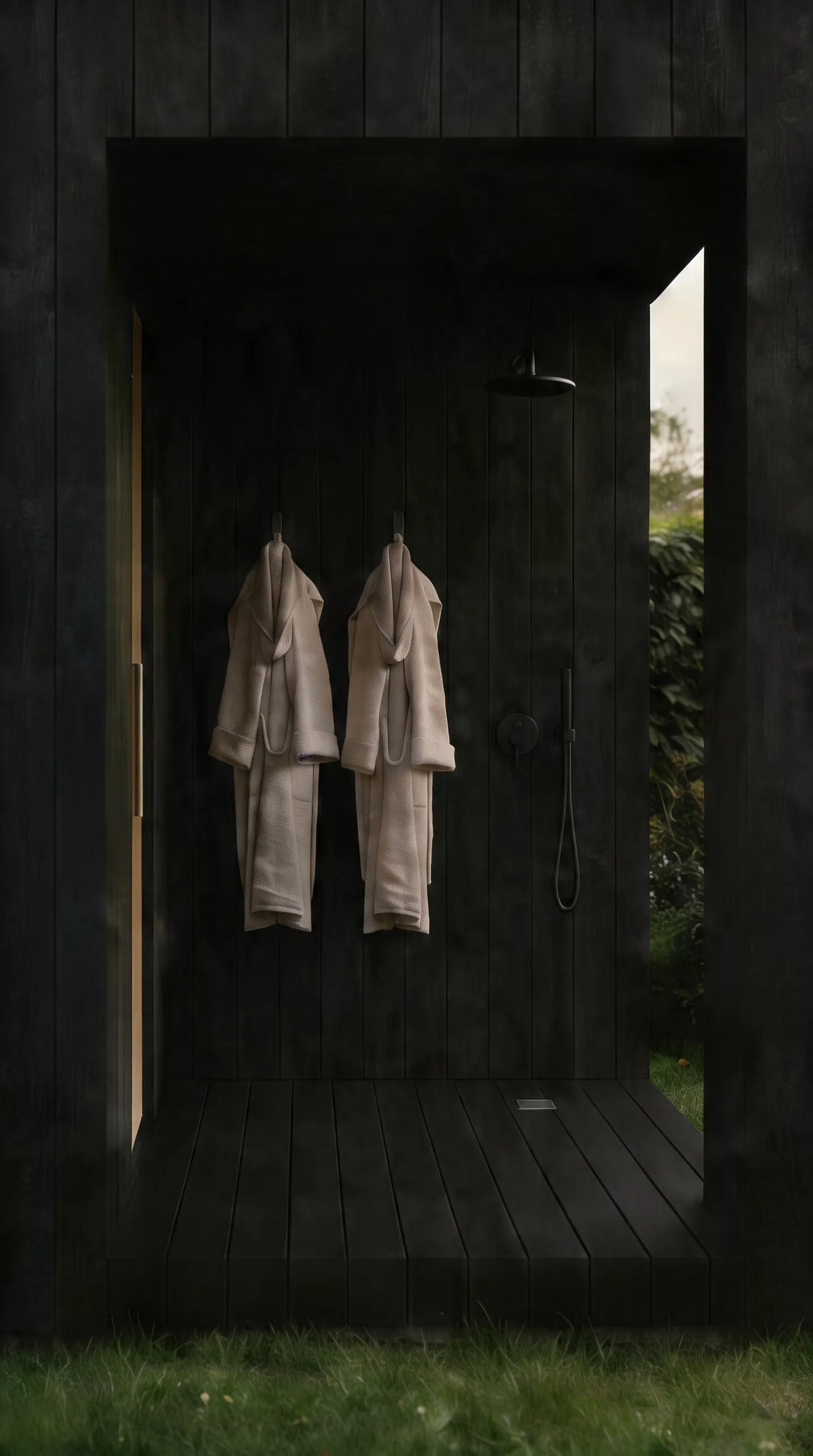 Visualisation of the NOOK Sauna's covered vestibule, with its outdoor shower and two bathrobes hanging